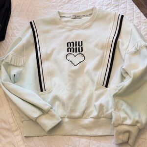 Miu Miu Cream Sweatshirt with Black Accents